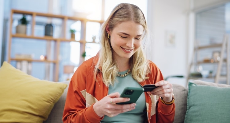 banking digital onboarding woman on a phone who is digitally onboarding