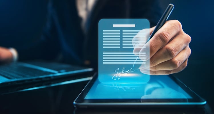 person digitally signing a document in IT company