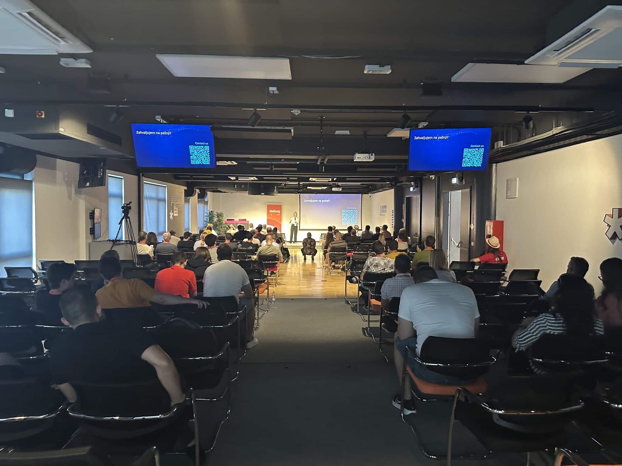 lead software developer at a developer conference holding a presentation in front of a big audience on document digitization, the use of AI and RAG