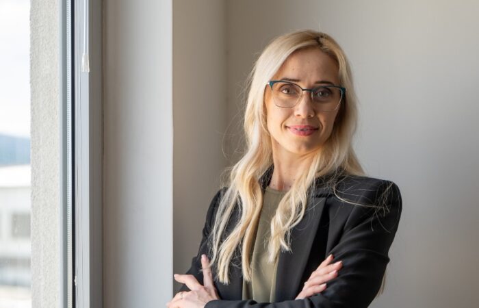 businesswoman lead software developer in IT company in a modern office smiling